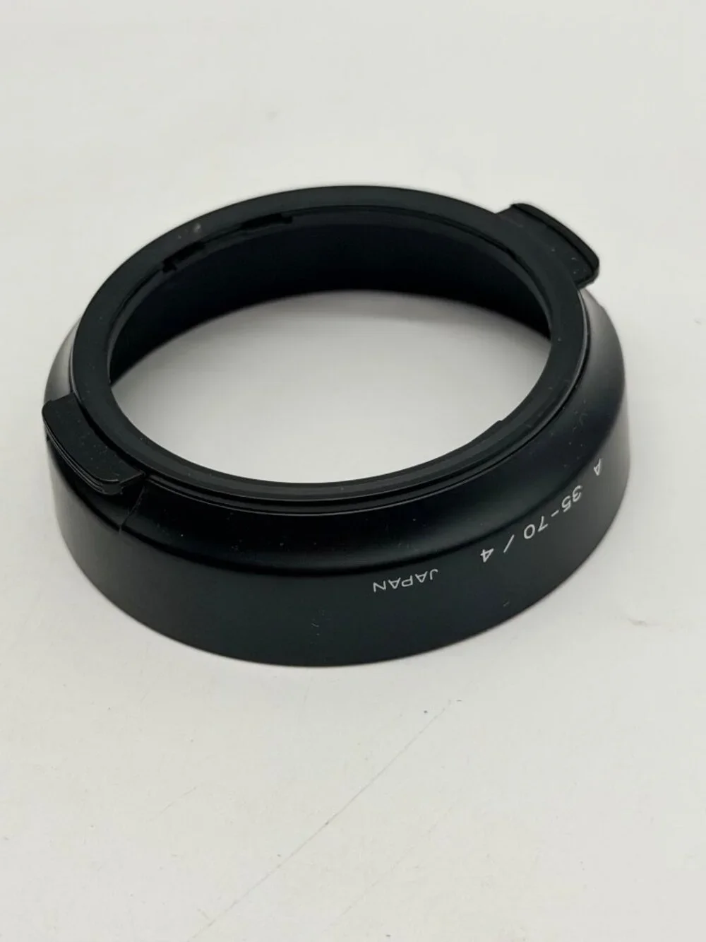 Minolta snap-on plastic lens hood specifically designed for the 35-70mm f/4 AF 